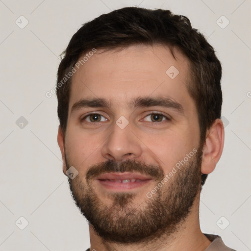 Joyful white young-adult male with short  brown hair and brown eyes