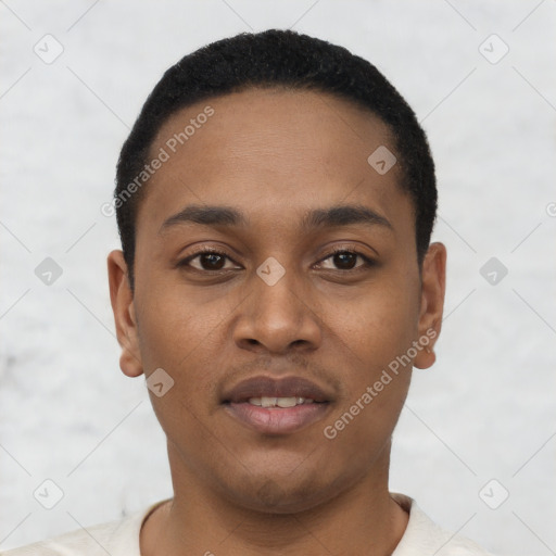 Joyful black young-adult male with short  black hair and brown eyes