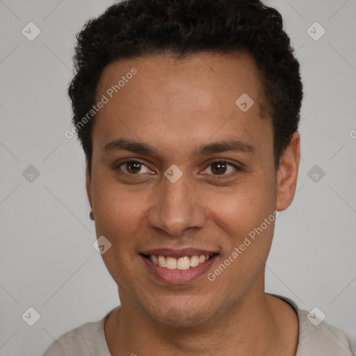 Joyful latino young-adult male with short  brown hair and brown eyes