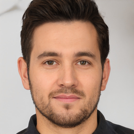 Joyful white young-adult male with short  brown hair and brown eyes