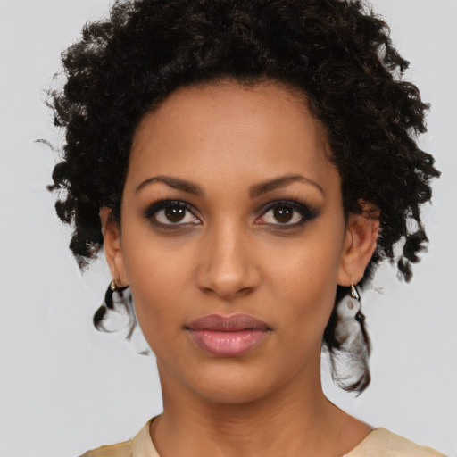 Neutral black young-adult female with medium  brown hair and brown eyes