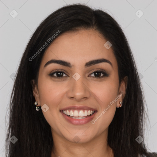 Joyful latino young-adult female with long  brown hair and brown eyes