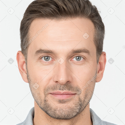 Joyful white adult male with short  brown hair and brown eyes