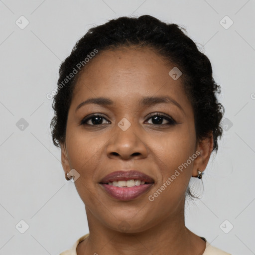 Joyful latino young-adult female with short  brown hair and brown eyes