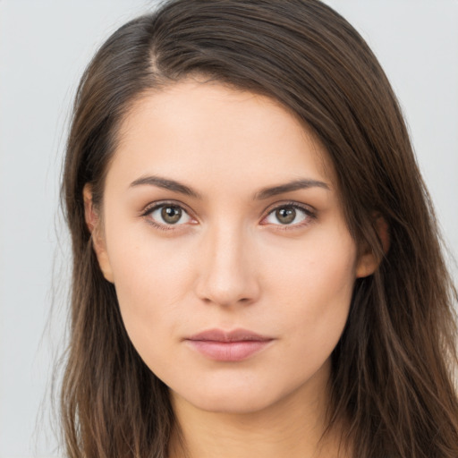 Neutral white young-adult female with long  brown hair and brown eyes