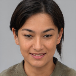 Joyful asian young-adult female with medium  brown hair and brown eyes