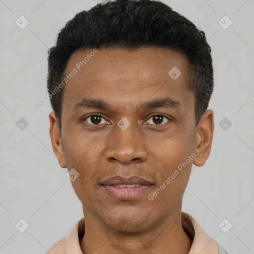 Joyful black young-adult male with short  black hair and brown eyes