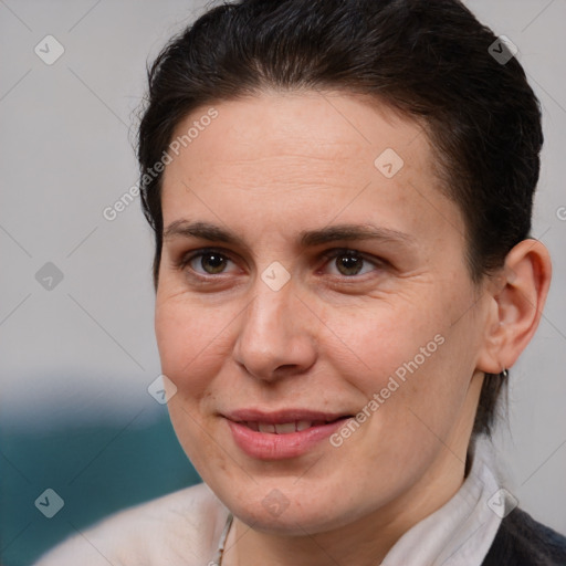 Joyful white adult female with medium  brown hair and brown eyes