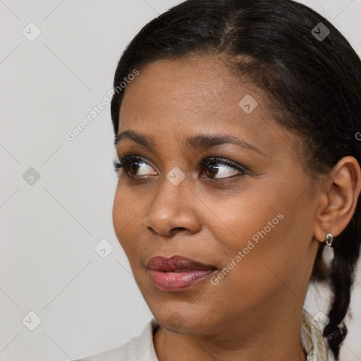 Joyful black young-adult female with medium  brown hair and brown eyes