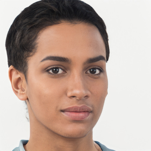 Joyful latino young-adult female with short  brown hair and brown eyes