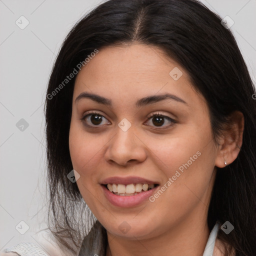 Joyful latino young-adult female with medium  brown hair and brown eyes