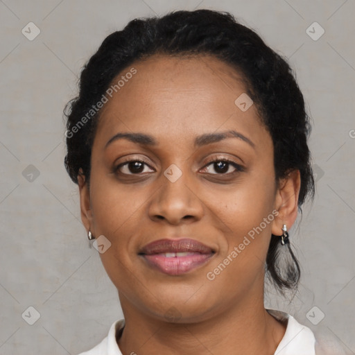 Joyful black adult female with short  black hair and brown eyes