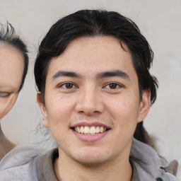 Joyful white young-adult male with medium  brown hair and brown eyes