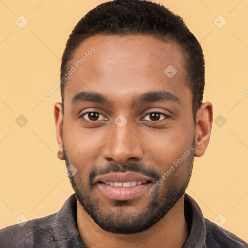 Joyful black young-adult male with short  black hair and brown eyes