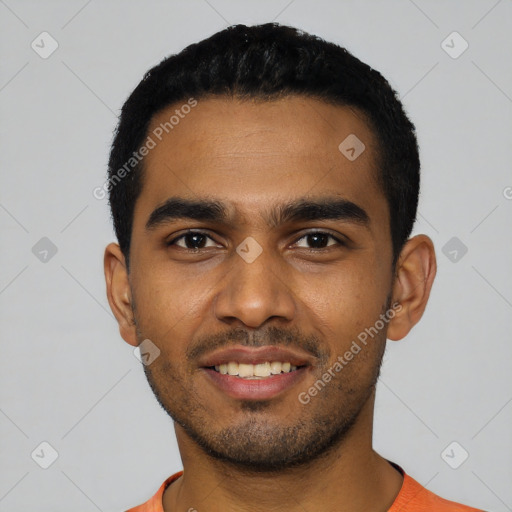 Joyful black young-adult male with short  black hair and brown eyes