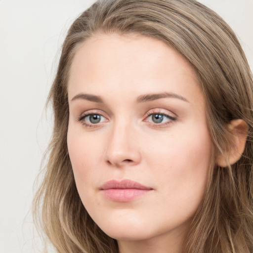 Neutral white young-adult female with long  brown hair and grey eyes