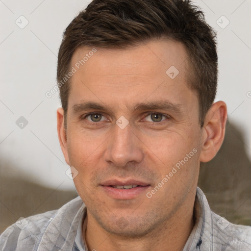 Joyful white adult male with short  brown hair and brown eyes