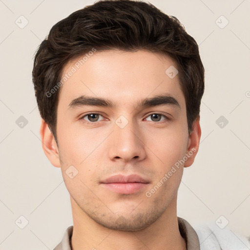 Neutral white young-adult male with short  brown hair and brown eyes