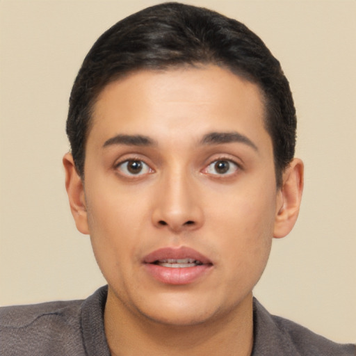 Neutral latino young-adult male with short  black hair and brown eyes