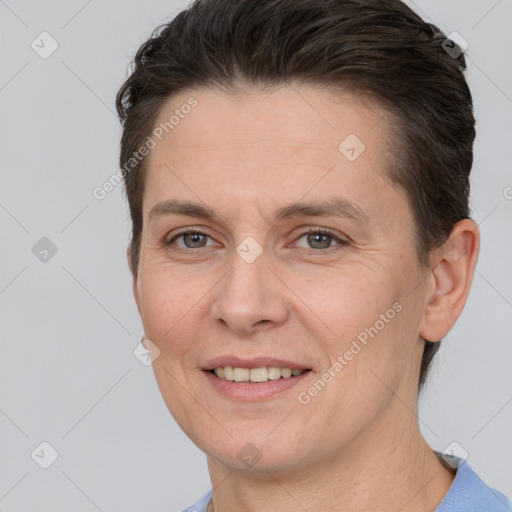 Joyful white adult female with short  brown hair and brown eyes