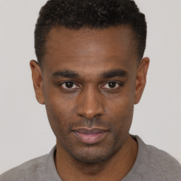 Neutral black young-adult male with short  black hair and brown eyes