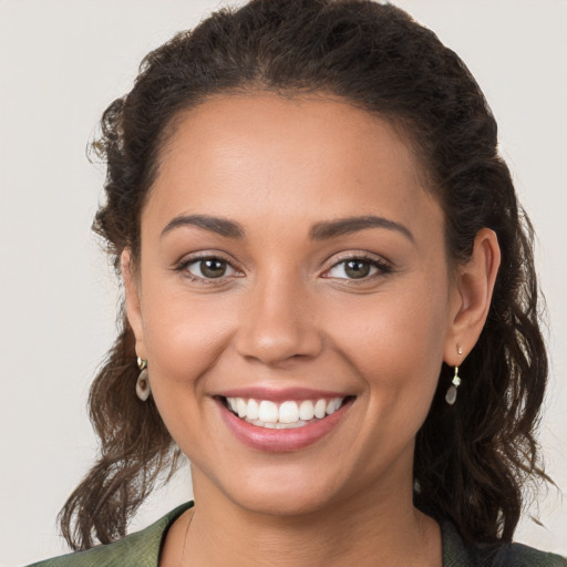 Joyful white young-adult female with long  brown hair and brown eyes