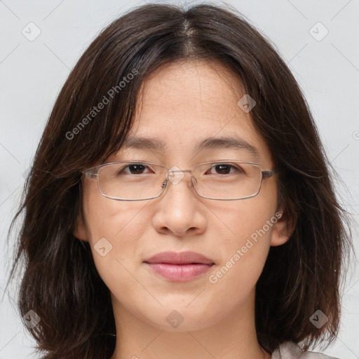 Joyful white adult female with medium  brown hair and brown eyes