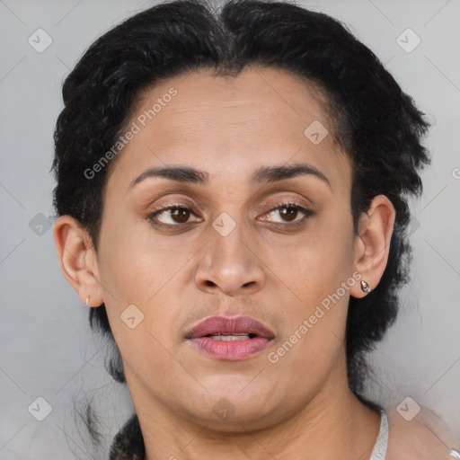 Joyful latino adult female with medium  brown hair and brown eyes