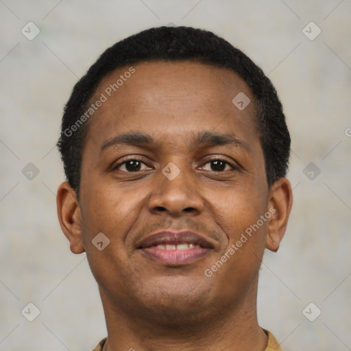 Joyful latino young-adult male with short  brown hair and brown eyes