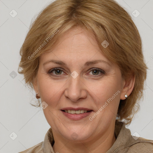 Joyful white adult female with medium  brown hair and brown eyes