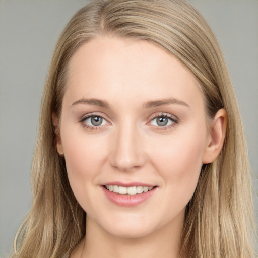 Joyful white young-adult female with long  brown hair and blue eyes