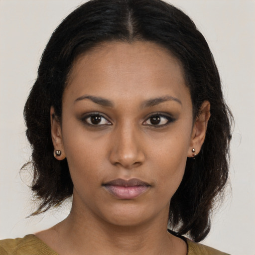 Neutral latino young-adult female with medium  brown hair and brown eyes