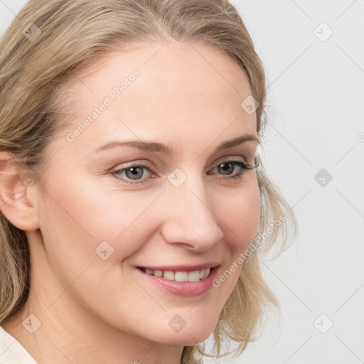 Joyful white young-adult female with medium  brown hair and blue eyes