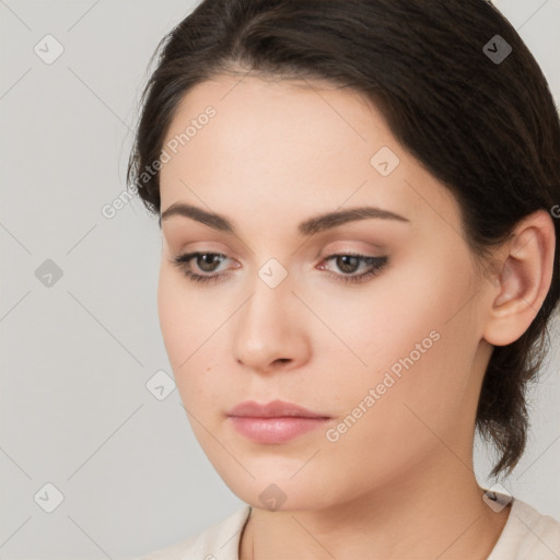 Neutral white young-adult female with medium  brown hair and brown eyes