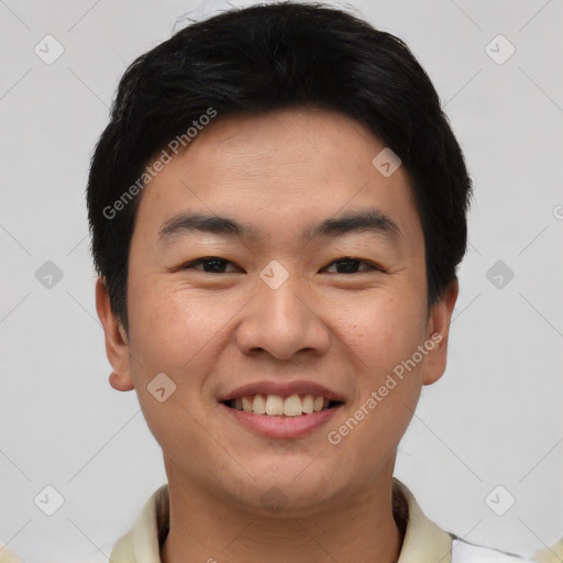 Joyful asian young-adult male with short  black hair and brown eyes