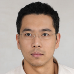 Neutral asian young-adult male with short  black hair and brown eyes