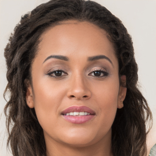 Joyful white young-adult female with long  brown hair and brown eyes