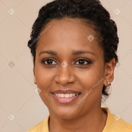 Joyful black young-adult female with short  brown hair and brown eyes