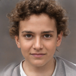 Joyful white child male with short  brown hair and brown eyes