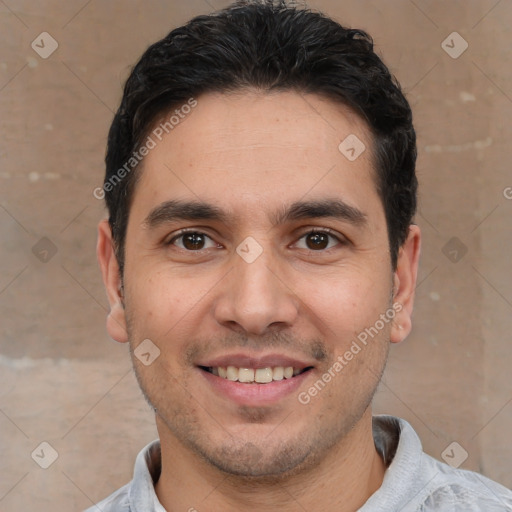 Joyful white young-adult male with short  black hair and brown eyes