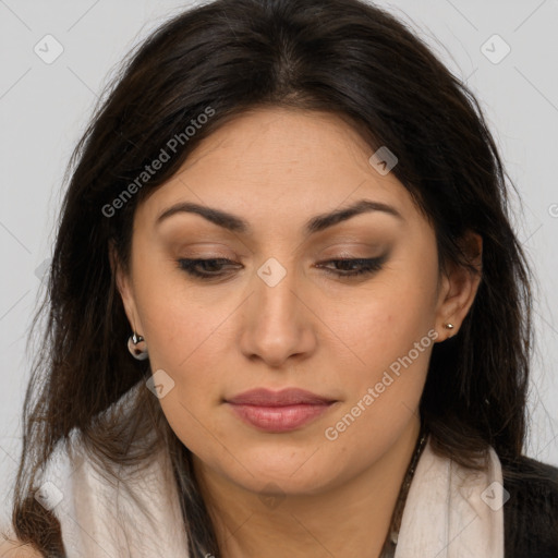 Joyful latino young-adult female with long  brown hair and brown eyes