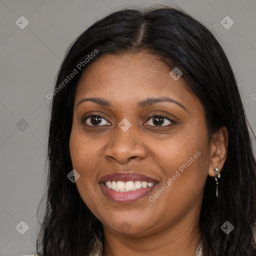 Joyful black young-adult female with long  brown hair and brown eyes