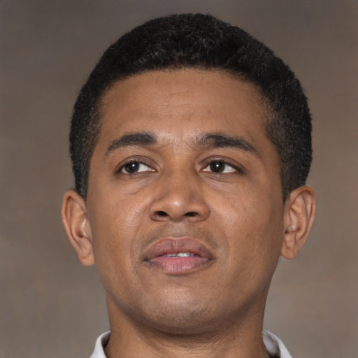 Neutral latino young-adult male with short  brown hair and brown eyes