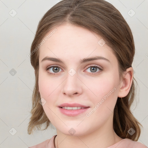 Joyful white young-adult female with medium  brown hair and green eyes