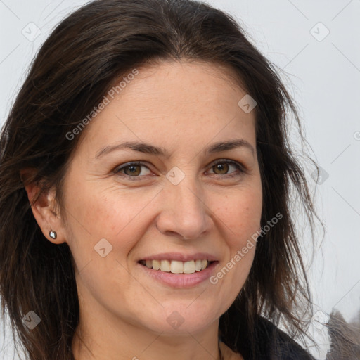 Joyful white adult female with long  brown hair and brown eyes