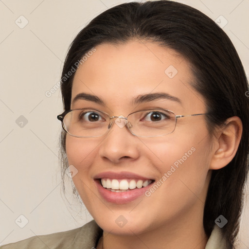 Joyful white young-adult female with medium  brown hair and brown eyes