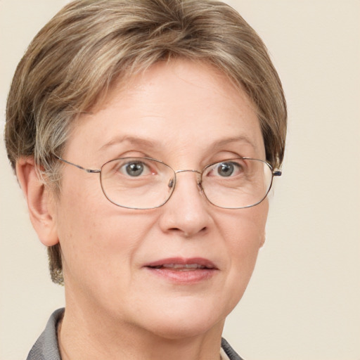 Joyful white adult female with short  brown hair and blue eyes