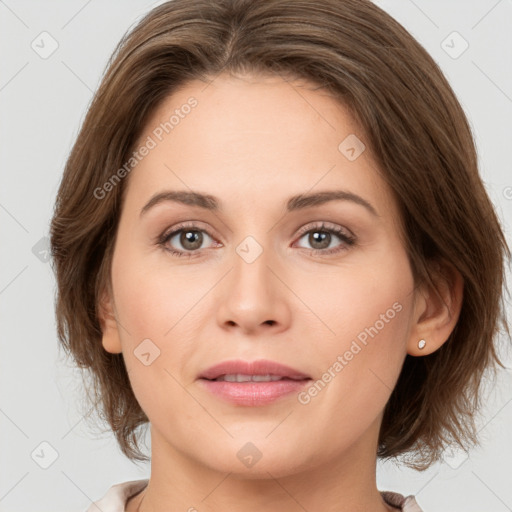 Joyful white young-adult female with medium  brown hair and green eyes