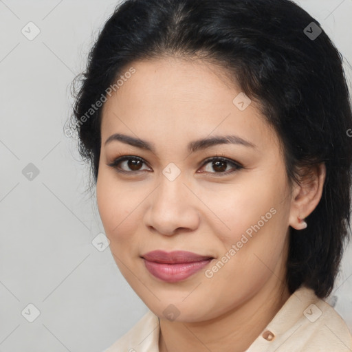 Joyful latino young-adult female with medium  brown hair and brown eyes