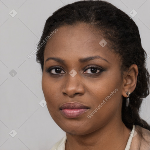 Joyful black young-adult female with medium  brown hair and brown eyes